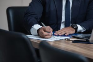 criminal lawyer sitting at desk doing paperwork